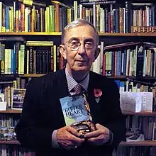 Peter Farquhar with his novel A Bitter Heart