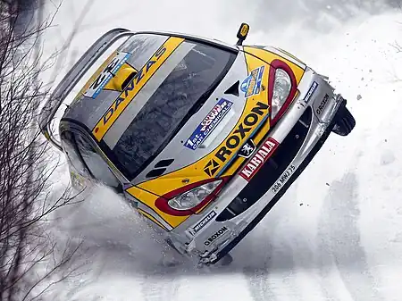 Image 3Juuso Pykälistö in his Peugeot 206 WRC during the 2003 Swedish Rally. Peugeot is a major French car brand, part of the PSA Peugeot Citroën group.