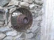 A window which Gulley made with the spoke rim of an old car