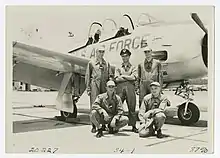 Photograph of men in front of a U.S. Air Force plane, Bainbridge, Georgia, 1956