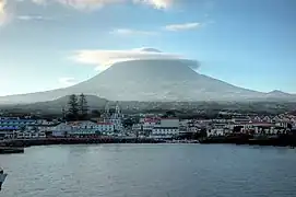 View off the coast of Madalena parish, showing the stratovolcano Pico and settlement of the municipal seat