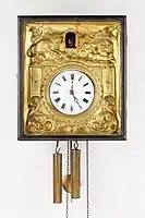 Picture frame clock with a serially stamped brass plate at the front, ca. 1850-1880 (Deutsches Uhrenmuseum, Inv. 05–3775)