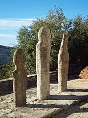 Three menhirs in front of the church of San Quilico, Piève, Nebbio