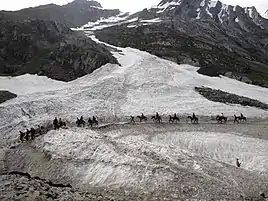 Pilgrims riding ponies on the way to the Amarnath Cave Temple