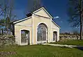 Pilistvere churchyard gate with walls.