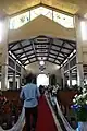 The interiors of the church's nave leading to the main door. The section with wooden gables was added during the expansion of the nave.