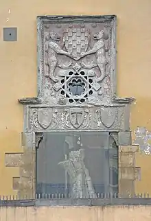 Entrance to Monastery with bears holding symbol of Pistoia and Tau symbol on lintel