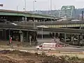 Truck on Forbes Avenue passing a ramp of the Birmingham Bridge in Bluff.