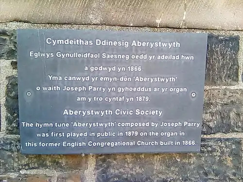 Plaque to commemorate the 1st performance of the hymn tune "Aberystwyth" on Aberystwyth town's former English Congregational church, now a medical surgery