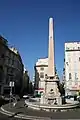 The Fontaine Fossati, in Place des Capucines, Marseille, features an obelisk and four dolphins. (1778).