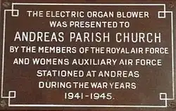 Plaque commemorating the donation of the organ blower to St Andrew's Church, Andreas.