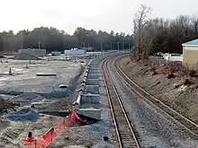 Concrete foundations for a station platform under construction