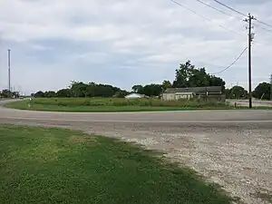 Looking north, FM 1301 can be seen at both the right and left side of the photo at the hairpin turn.