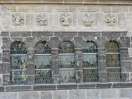 The five windows with frieze above.