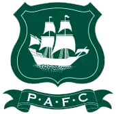 Plymouth Argyle's crest: The initials " underneath a shield featuring a ship called the Mayflower in full sail.