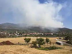 Fire on Trstelj Hill (2013).In the foreground, the village of Lipa.