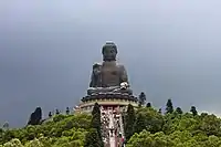 Tian Tan Buddha, a large bronze statue of Amoghasiddhi, located at Ngong Ping, Lantau Island, in Hong Kong. The statue is 34 metres (112 ft) tall, weighs over 250 metric tons (280 short tons)