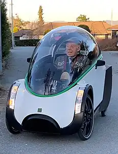 A fully-enclosed velomobile with a bubble fairing