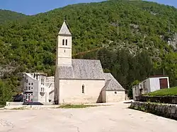 Simple white church on a hillside