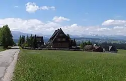 Houses in Bustryk. Tatra Mountains in the background.