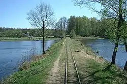 Dam on the Topiło Lake, with narrow gauge railway