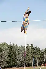 Image 13Anna Giordano Bruno releases the pole after clearing the bar (from Track and field)