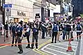 Police enclosing the pedestrian zone of Great George Street, intercepting citizens wearing black clothes and holding flowers