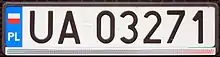 A rectangular plate reading UA03271