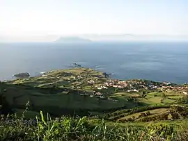 View of Ponta Delgada das Flores, with the distant island of Corvo