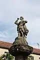 Statue of the Roman goddess Fama crowning the fountain in the square