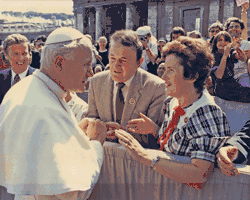 Two people meeting Pope John Paul II