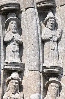 Sculptures in voussure of entrance to south porch: Daniel at right, Isaiah on left, with heads of Jeremiah and Ezekiel below .