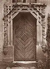 Black and white photograph showing a gothic portal.