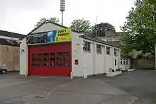 White building with red doors