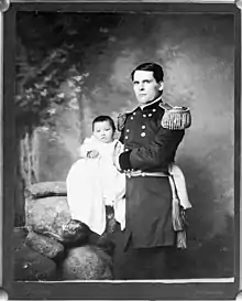 Photo of Zintkála Nuni at 4 months old, held by her adoptive father, General Leonard Colby.