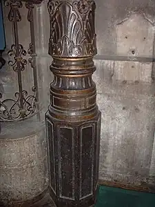 A sculpted cast iron post from the interior