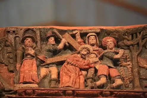 One of the bas-reliefs carved on the rood screen beam: Jesus carrying the cross
