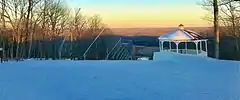 View downhill from the Middlefield ski slope at sunset in Powder Ridge Mountain Park and Resort.