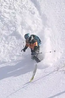  Linda Peer telemark skiing in powder.