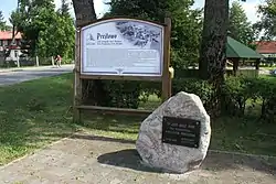 Information board and memorial stone in Prejłowo