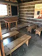 Inside the replica of Prescott's first community schoolhouse.