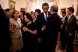 President Obama speaks with Interior Secretary Salazar in one of the Drawing Rooms