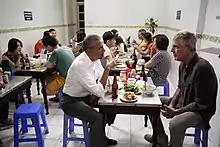 Coloured image of former president, Barack Obama, and celebrity chef,Bún cha Huong Lien Restaurant in Hanoi, Vietnam. Anthony Bourdain, dining at