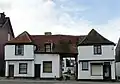 16th-century wooden-framed house with centre cartway west of the church in Prittlewell