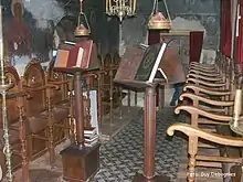 Eastern Orthodox choir stalls (kathisma) on the kliros (area for the choir) with analogia (lecterns) for liturgical books