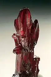 Proustite (long prismatic crystal) - Chañarcillo, Copiapo Province,  Chile. Specimen height is 4 cm.