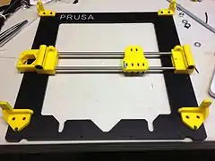 Metal frame and constructed X axis, printed parts in yellow.