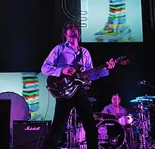 Jarvis Cocker and Nick Banks performing with Pulpat the Coachella Festival in 2012.