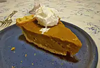 Pumpkin pie topped with Cool Whip