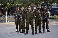 Five uniformed officers